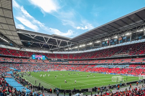 A football stadium with a match taking place